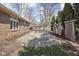 Home exterior featuring a brick facade and a concrete patio at 10109 Fergus Ave, Carmel, IN 46032