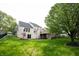 Large, grassy backyard with a deck and patio, perfect for outdoor enjoyment and entertaining at 10365 Aurora Ct, Fishers, IN 46038