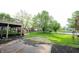 View of the backyard showing deck with stairs, patio and partial fence in the background at 10365 Aurora Ct, Fishers, IN 46038