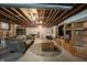 Cozy basement featuring exposed ceiling, comfortable seating, and a television at 10365 Aurora Ct, Fishers, IN 46038