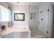 Modern bathroom features a glass shower and separate soaking tub at 10365 Aurora Ct, Fishers, IN 46038