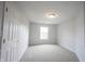 Bright bedroom featuring neutral carpet, wainscotting and a window allowing natural light at 10365 Aurora Ct, Fishers, IN 46038