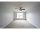 Bright bedroom featuring neutral carpet, and a window allowing natural light at 10365 Aurora Ct, Fishers, IN 46038