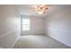 Bright bedroom featuring neutral carpet, wainscotting and a window allowing natural light at 10365 Aurora Ct, Fishers, IN 46038
