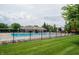 Community pool surrounded by a wrought iron fence and lush landscaping, perfect for relaxation and recreation at 10365 Aurora Ct, Fishers, IN 46038