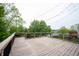 Spacious outdoor deck offering scenic views of a lush green landscape and a lake at 10365 Aurora Ct, Fishers, IN 46038
