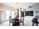 Bright dining space with direct access to the backyard through French doors, perfect for indoor/outdoor living at 10365 Aurora Ct, Fishers, IN 46038