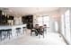 Stylish dining area with modern chandelier, seamlessly connected to the kitchen and living spaces at 10365 Aurora Ct, Fishers, IN 46038