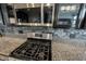 Close-up showcasing modern range, stainless steel appliances, and beautiful backsplash in the kitchen at 10365 Aurora Ct, Fishers, IN 46038