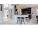 Kitchen with breakfast bar that features sleek black stools and stylish pendant lighting at 10365 Aurora Ct, Fishers, IN 46038