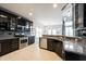 Well-equipped kitchen featuring sleek cabinetry, modern appliances, and a convenient breakfast bar at 10365 Aurora Ct, Fishers, IN 46038