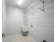Bright laundry room with utility sink and wire shelving for storage solutions at 10365 Aurora Ct, Fishers, IN 46038