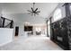 Expansive open-concept living room featuring vaulted ceilings and a stone fireplace, perfect for entertaining at 10365 Aurora Ct, Fishers, IN 46038