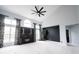 Spacious living room with high ceilings, a modern fireplace, and large windows with stylish curtains at 10365 Aurora Ct, Fishers, IN 46038