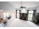 Open concept living room boasts soaring ceilings and a cozy fireplace at 10365 Aurora Ct, Fishers, IN 46038