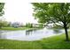 Beautiful pond with a fountain and well maintained landscaping in a lush community at 10365 Aurora Ct, Fishers, IN 46038