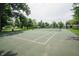 Well-maintained community tennis court with lush green surroundings, ideal for recreational play at 10365 Aurora Ct, Fishers, IN 46038