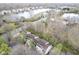 Aerial of the apartment complex showing proximity to lake and surrounding green spaces at 1127 Island Woods Dr # 56, Indianapolis, IN 46220