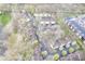 Aerial view of condo complex surrounded by mature trees and a private parking lot at 1127 Island Woods Dr # 56, Indianapolis, IN 46220