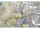 Overhead view of townhome community surrounded by mature trees and private parking at 1127 Island Woods Dr # 56, Indianapolis, IN 46220
