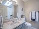 Well-maintained bathroom with a skylight, a neutral color scheme, and essential fixtures at 1127 Island Woods Dr # 56, Indianapolis, IN 46220