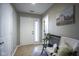 Bright entryway featuring neutral walls, tile floors, and a comfortable bench with decorative pillows at 1127 Island Woods Dr # 56, Indianapolis, IN 46220