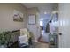 Inviting entryway with bench seating, a barn painting, and access to other rooms in the house at 1127 Island Woods Dr # 56, Indianapolis, IN 46220