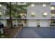 Inviting townhome featuring a private balcony, individual garage, and charming curb appeal at 1127 Island Woods Dr # 56, Indianapolis, IN 46220