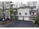 Charming two-story townhome with private balconies, individual garages, and well-maintained landscaping at 1127 Island Woods Dr # 56, Indianapolis, IN 46220