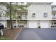 Inviting townhome featuring a private balcony, individual garage, and charming curb appeal at 1127 Island Woods Dr # 56, Indianapolis, IN 46220
