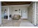 Welcoming front porch with bench seating, a decorated wreath, and a charming, cozy ambiance at 1127 Island Woods Dr # 56, Indianapolis, IN 46220
