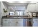 Open concept kitchen features stainless steel appliances and granite countertops at 1127 Island Woods Dr # 56, Indianapolis, IN 46220