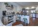 Bright kitchenette with a barn door cabinet, granite counters and stainless appliances at 1127 Island Woods Dr # 56, Indianapolis, IN 46220