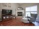Comfortable living room with a fireplace, large TV, and a cozy seating area at 1127 Island Woods Dr # 56, Indianapolis, IN 46220