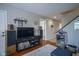 Inviting living room featuring a television, speakers, and hardwood floors, perfect for relaxation at 1127 Island Woods Dr # 56, Indianapolis, IN 46220