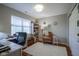 Bright office space with hardwood floors, a large window, and a cozy rocking chair at 1127 Island Woods Dr # 56, Indianapolis, IN 46220