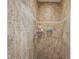 Tiled shower stall showcasing neutral-toned tiles and functional shower fixtures at 1127 Island Woods Dr # 56, Indianapolis, IN 46220
