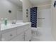 Bright bathroom features a modern vanity, ample counter space, and tiled floors at 11339 Fonthill Dr, Indianapolis, IN 46236
