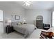 Inviting bedroom includes a ceiling fan, ample natural light, and a cozy rocking chair at 11339 Fonthill Dr, Indianapolis, IN 46236