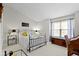 Comfortable bedroom featuring a large window with a bench, ideal for relaxing at 11339 Fonthill Dr, Indianapolis, IN 46236