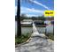 Private boat dock with several boats docked, accessible by a stone path at 11339 Fonthill Dr, Indianapolis, IN 46236