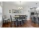 Inviting dining area connects seamlessly to the kitchen, featuring a contemporary chandelier and stylish decor at 11339 Fonthill Dr, Indianapolis, IN 46236
