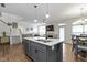 Kitchen island with quartz countertop. Living room and dining room in background at 11339 Fonthill Dr, Indianapolis, IN 46236