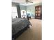 Bedroom featuring neutral carpet, ceiling fan and large armoire at 11863 Edgefield Dr, Fishers, IN 46037