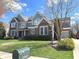 Inviting home with a brick facade, a well-manicured lawn, and a charming mailbox in a serene neighborhood at 11863 Edgefield Dr, Fishers, IN 46037