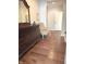 Hallway featuring wood floors, chair, and a large wooden dresser at 11863 Edgefield Dr, Fishers, IN 46037