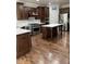 Kitchen with a center island, custom wood cabinets, stainless steel appliances and tile backsplash at 11863 Edgefield Dr, Fishers, IN 46037