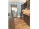 Kitchen featuring stainless steel appliances, wood floors and dark wood cabinets at 11863 Edgefield Dr, Fishers, IN 46037