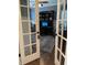 Sophisticated office with French doors, dark wood accents, and a comfortable workspace for productivity and style at 11863 Edgefield Dr, Fishers, IN 46037