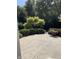 Spacious patio featuring a decorative garden with flowers, shrubs, and manicured trees at 11863 Edgefield Dr, Fishers, IN 46037